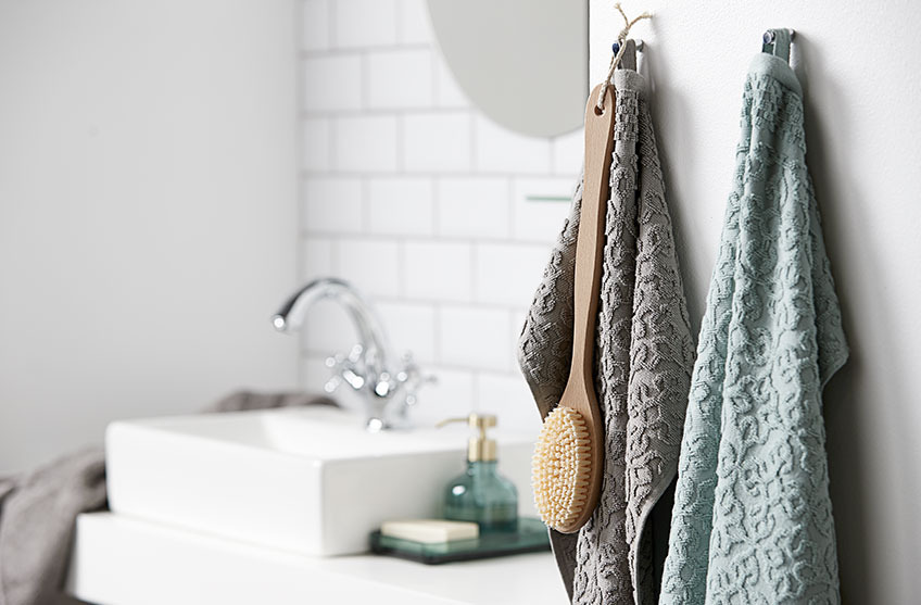 STIDSVIG towels have a beautiful pattern Patterned towels hanging in a bathroom