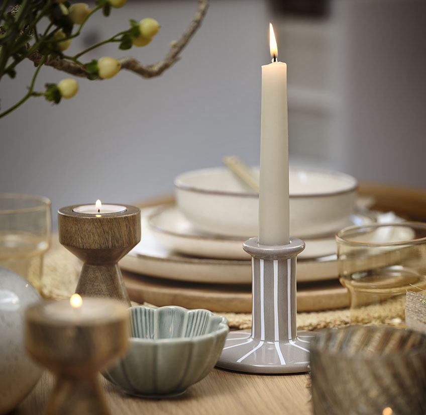 SIMON bowl, MARK candlestick and JOHAN tealight holder Dinner table setting with tealights and taper candles in candlesticks