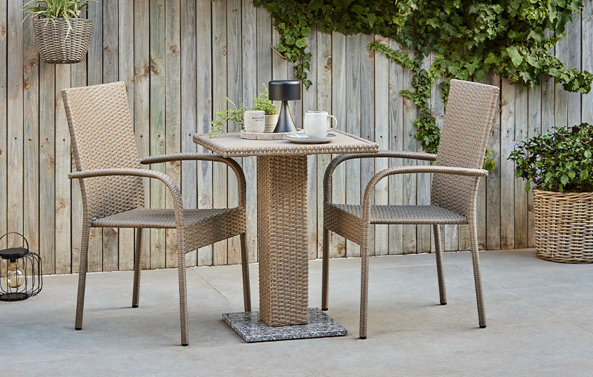THY bistro table and GUDHJEM garden chairs, both made with polyrattan Polyrattan garden furniture such as bistro table and garden chairs made with synthetic rattan
