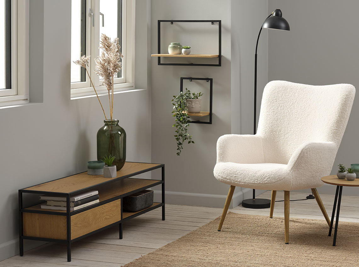 TRAPPEDAL TV bench and HUNDESTED armchair TV unit with storage below a window and next to an armchair