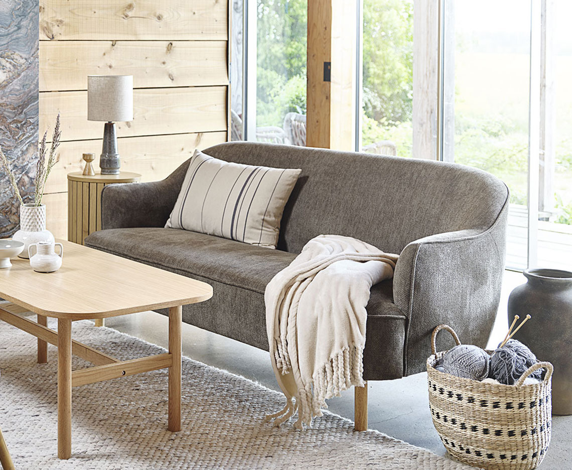 BREDAL 2.5 seater sofa Green 2.5-seater sofa arranged with coffee table and home decorations