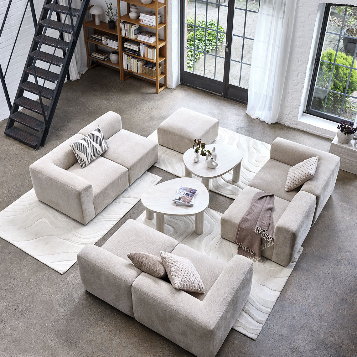 SKEJBY modular sofa Beige modular sofa split into different modules in a living room area