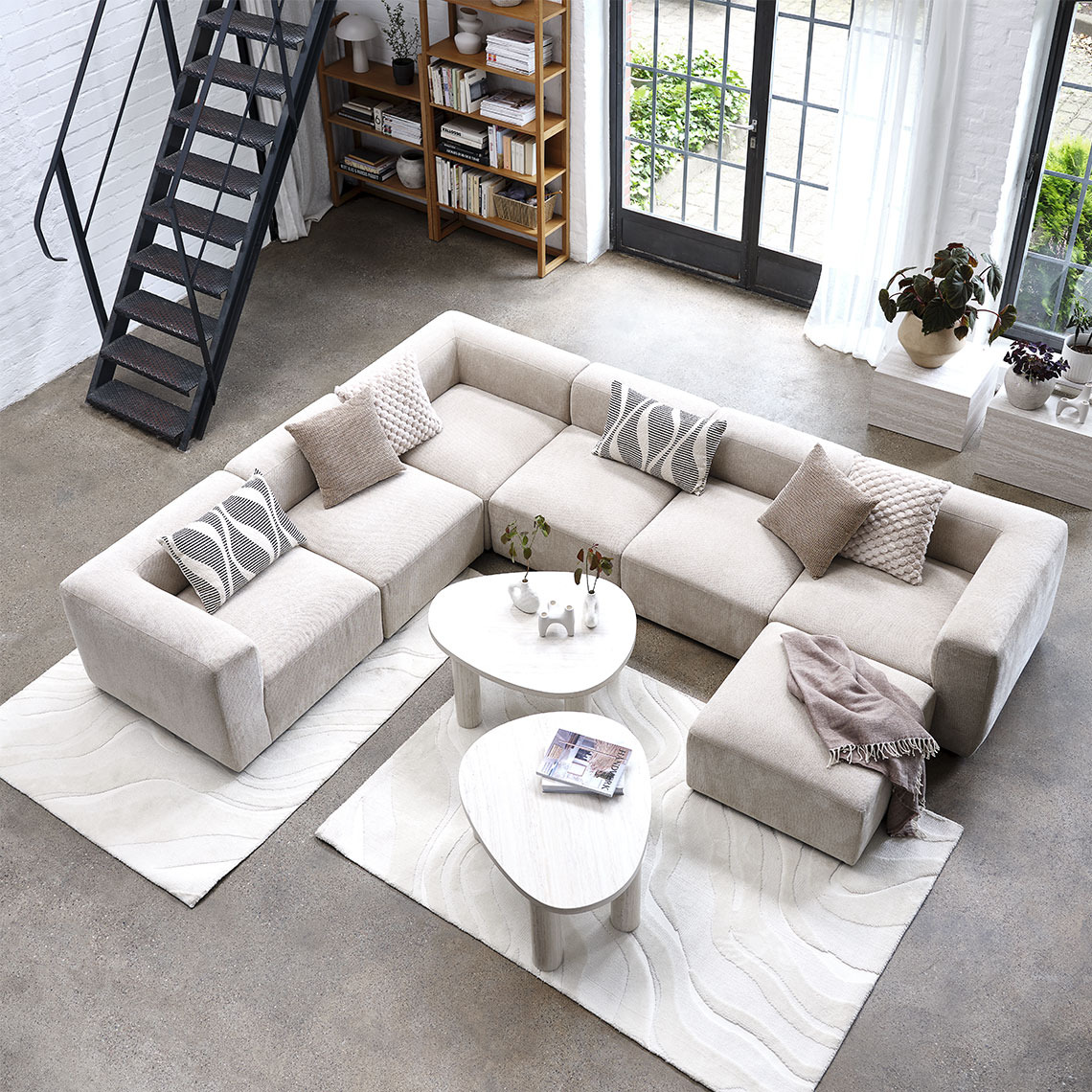 SKEJBY modular sofa Beige modular sofa reconfigured as a U-shape in a living room area