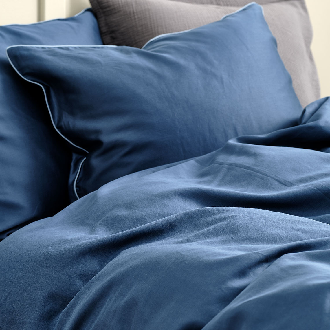 Bedding made from bamboo-derived viscose is great for staying cooler throughout the night Blue sateen bedding made from a blend of cotton and bamboo viscose