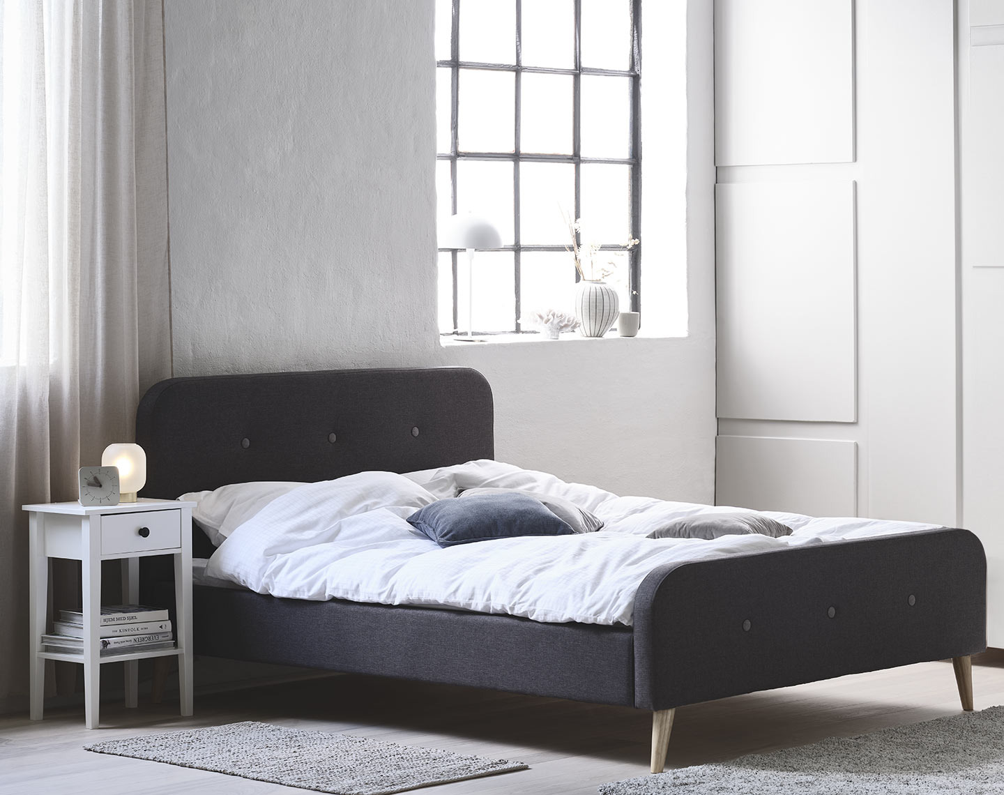 KONGSBERG bed frame and NORDBY bedside table Upholstered bed frame in a bedroom with
