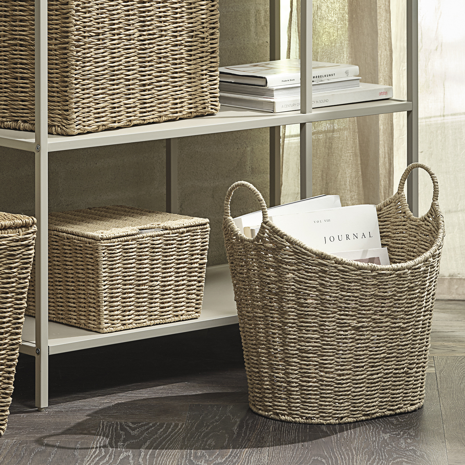 Storage basket on the floor and on a shelving unit