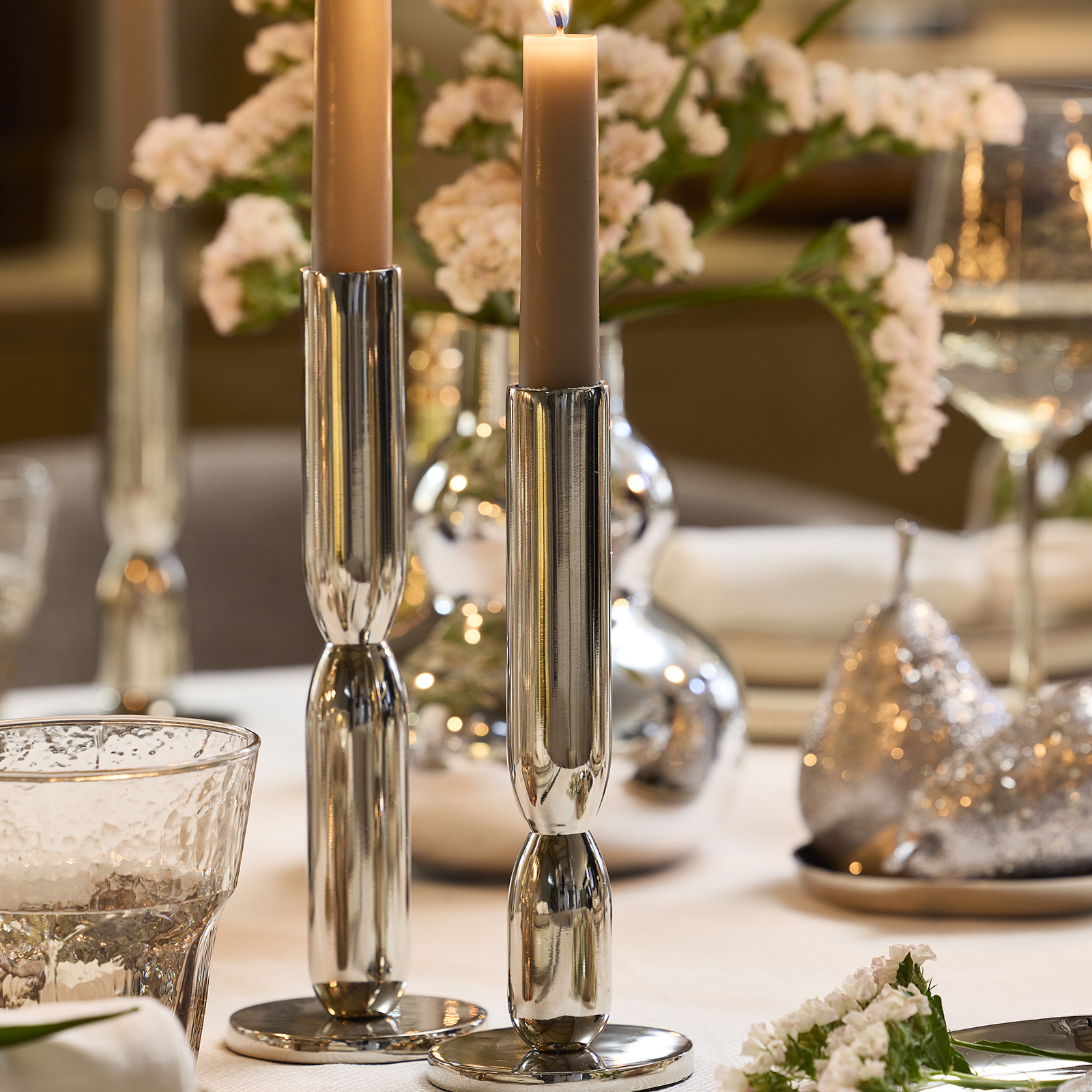 ADRIAN candlesticks Dinner table with two candlesticks in a silver colour