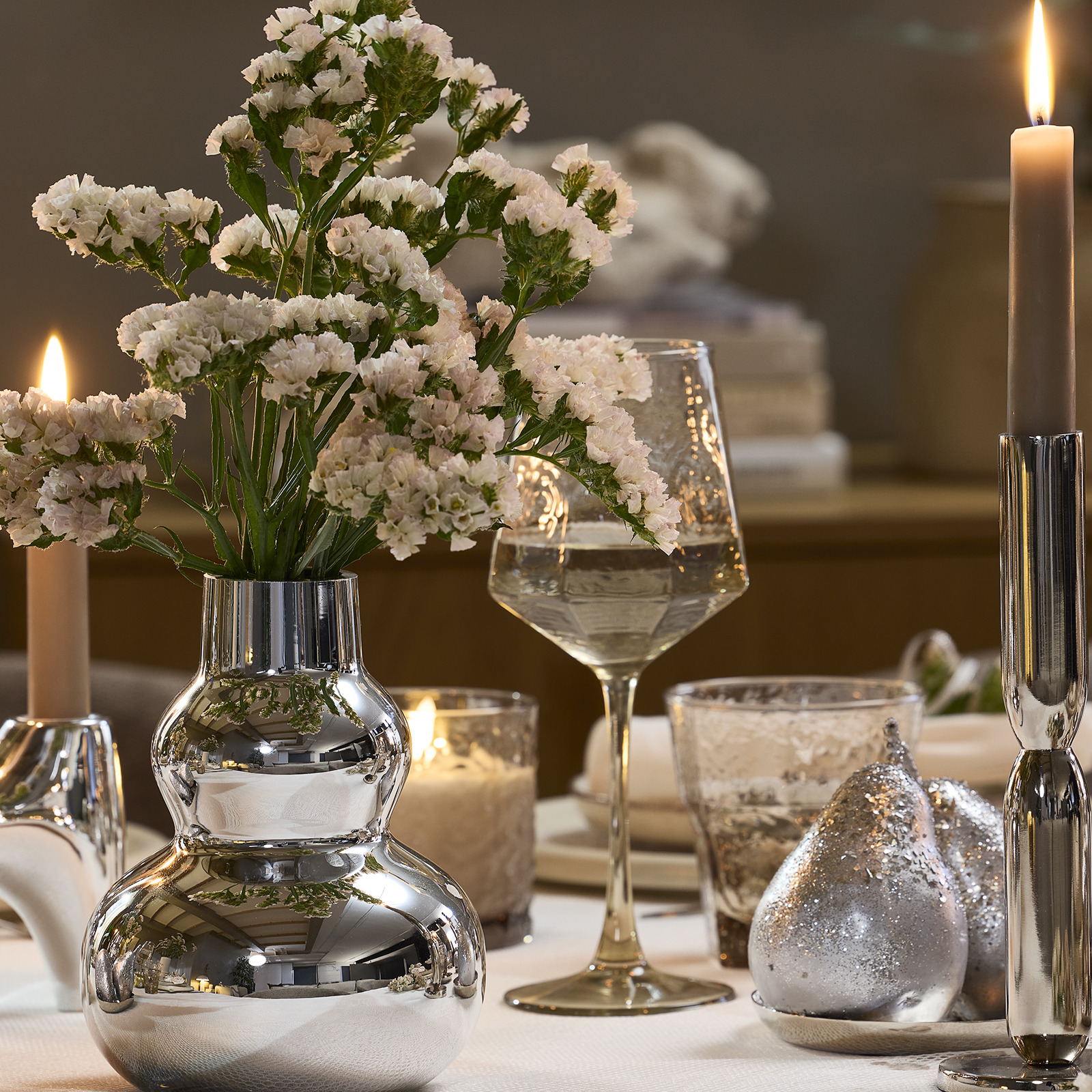 CHRISTOFFER vase and GUNVALD wine glass Dinner table with wine glass and vase in silver look