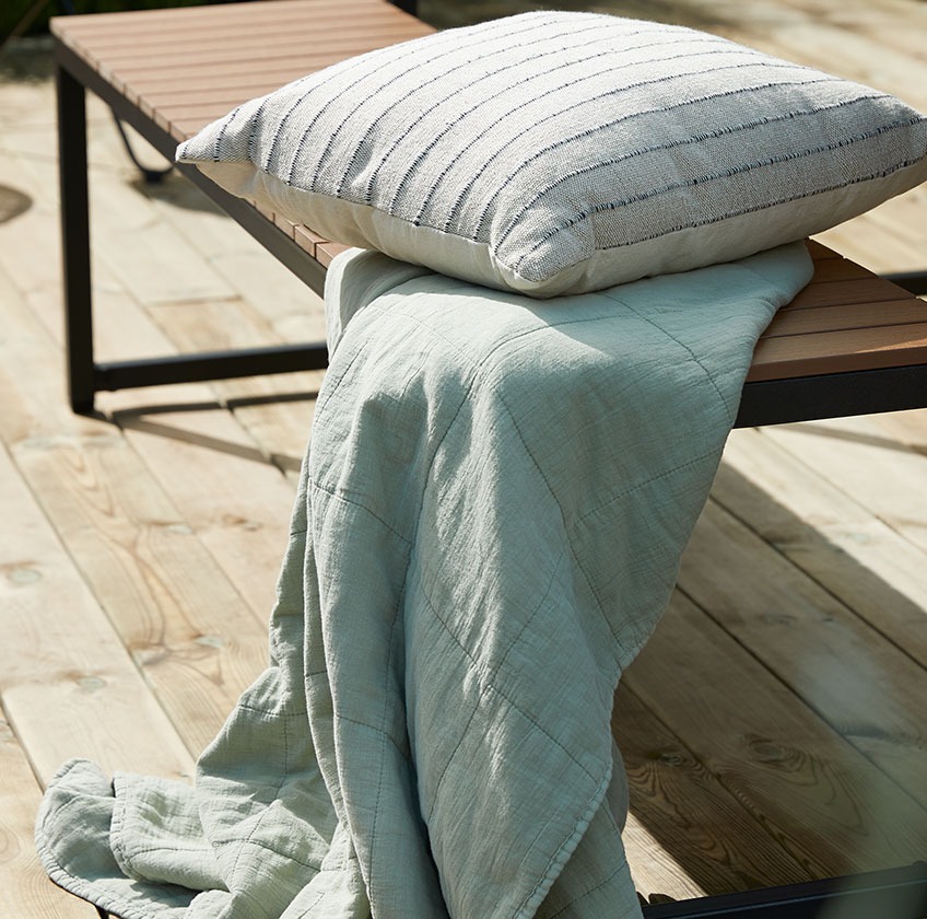 DAGSVAD bench with ENGKARSE cushion and VALMUE throw Wood garden bench with a throw and a cushion
