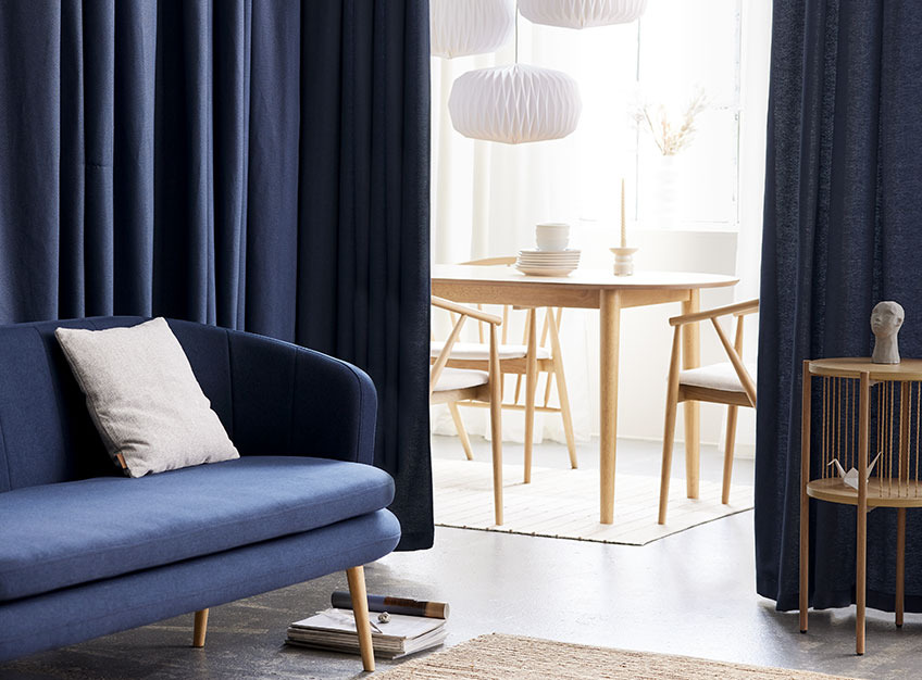 Blue AUSTRA curtains Curtains used as room dividers between a dining room and a living room