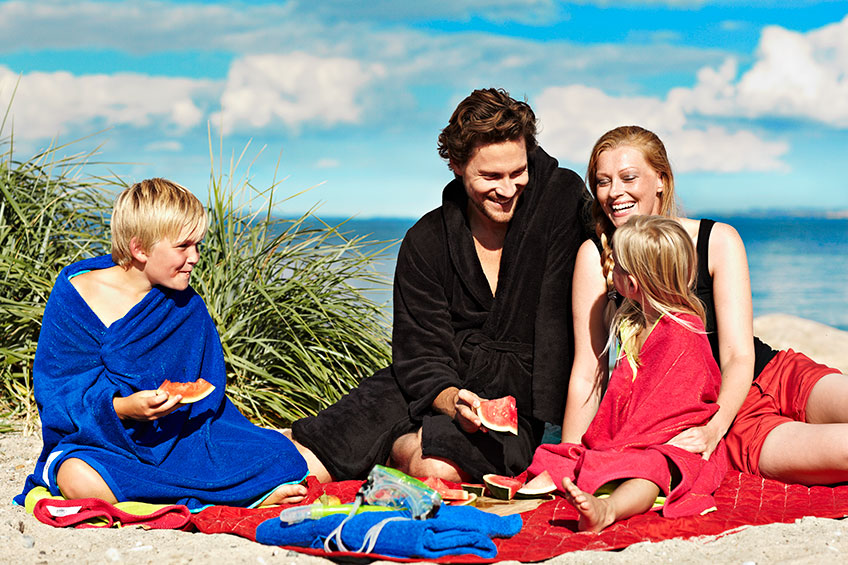 Family having picnic on the beach Family having picnic on the beach